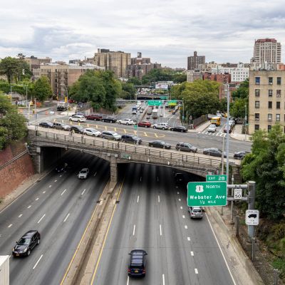 Partners laughing together at a park bench