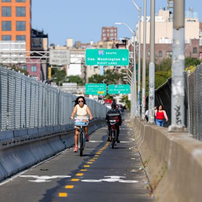 Two partners walking through a park, deep in conversation